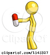 Yellow Design Mascot Woman Holding Red Pill Walking To Left