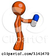 Orange Design Mascot Man Holding Blue Pill Walking To Right
