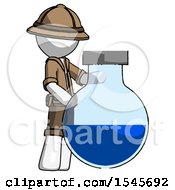 White Explorer Ranger Man Standing Beside Large Round Flask Or Beaker