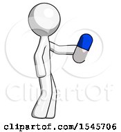 White Design Mascot Man Holding Blue Pill Walking To Right