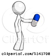 White Design Mascot Woman Holding Blue Pill Walking To Right