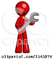 Red Design Mascot Man Holding Large Wrench With Both Hands