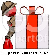 Red Explorer Ranger Man Gift Concept Leaning Against Large Present