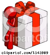 Red Design Mascot Man Leaning On Gift With Red Bow Angle View