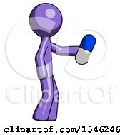 Purple Design Mascot Man Holding Blue Pill Walking To Right