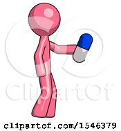 Pink Design Mascot Man Holding Blue Pill Walking To Right