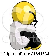 Yellow Doctor Scientist Man Sitting With Head Down Back View Facing Right