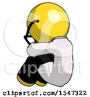 Yellow Doctor Scientist Man Sitting With Head Down Back View Facing Left
