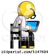 Yellow Doctor Scientist Man Using Laptop Computer While Sitting In Chair View From Back