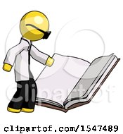 Yellow Doctor Scientist Man Reading Big Book While Standing Beside It