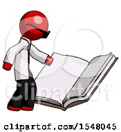 Red Doctor Scientist Man Reading Big Book While Standing Beside It