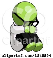 Green Doctor Scientist Man Sitting With Head Down Facing Angle Right