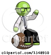 Poster, Art Print Of Green Doctor Scientist Man Sitting On Giant Football