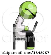 Green Doctor Scientist Man Using Laptop Computer While Sitting In Chair View From Side