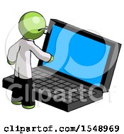 Green Doctor Scientist Man Using Large Laptop Computer