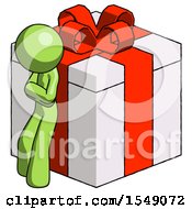 Green Design Mascot Man Leaning On Gift With Red Bow Angle View