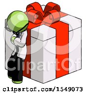 Green Doctor Scientist Man Leaning On Gift With Red Bow Angle View