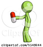 Green Design Mascot Man Holding Red Pill Walking To Left