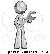 Gray Design Mascot Woman Holding Large Wrench With Both Hands
