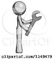 Gray Design Mascot Woman Using Wrench Adjusting Something To Right