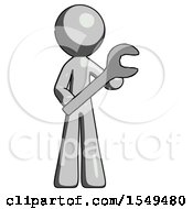 Gray Design Mascot Man Holding Large Wrench With Both Hands