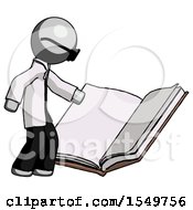 Gray Doctor Scientist Man Reading Big Book While Standing Beside It