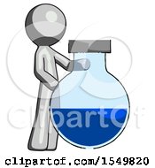 Gray Design Mascot Man Standing Beside Large Round Flask Or Beaker