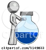 Gray Design Mascot Woman Standing Beside Large Round Flask Or Beaker