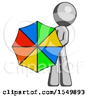 Gray Design Mascot Man Holding Rainbow Umbrella Out To Viewer