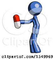 Blue Design Mascot Woman Holding Red Pill Walking To Left