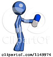 Blue Design Mascot Woman Holding Blue Pill Walking To Right