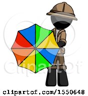 Black Explorer Ranger Man Holding Rainbow Umbrella Out To Viewer