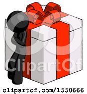 Black Design Mascot Man Leaning On Gift With Red Bow Angle View