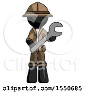 Black Explorer Ranger Man Holding Large Wrench With Both Hands