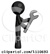 Black Design Mascot Man Using Wrench Adjusting Something To Right