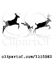 Poster, Art Print Of Black Silhouetted Deer Family Leaping With A Shadow On A White Background