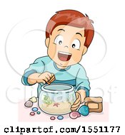 Boy Decorating A Fish Bowl