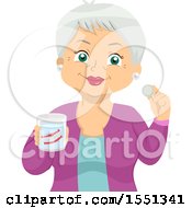 Happy Senior Woman Holding A Cup With Her Dentures And A Cleaning Tablet