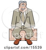 Sad Businessman Sitting Alone On A Bench