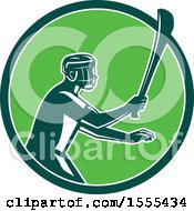 Clipart Of A Retro Male Hurling Player Holding A Wooden Hurley Stick In A Green Circle Royalty Free Vector Illustration