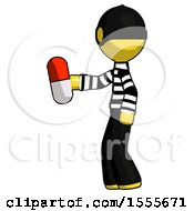 Poster, Art Print Of Yellow Thief Man Holding Red Pill Walking To Left