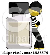 Yellow Thief Man Leaning Against Large Medicine Bottle