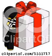 Poster, Art Print Of Yellow Thief Man Leaning On Gift With Red Bow Angle View