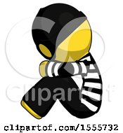 Poster, Art Print Of Yellow Thief Man Sitting With Head Down Facing Sideways Left