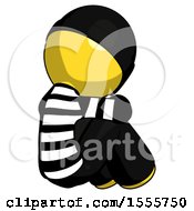 Poster, Art Print Of Yellow Thief Man Sitting With Head Down Back View Facing Right