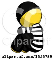 Poster, Art Print Of Yellow Thief Man Sitting With Head Down Back View Facing Left