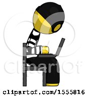 Poster, Art Print Of Yellow Thief Man Using Laptop Computer While Sitting In Chair View From Side