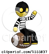 Poster, Art Print Of Yellow Thief Man Sitting On Giant Football