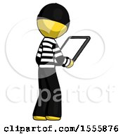 Poster, Art Print Of Yellow Thief Man Looking At Tablet Device Computer Facing Away