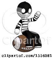 Poster, Art Print Of White Thief Man Sitting On Giant Football